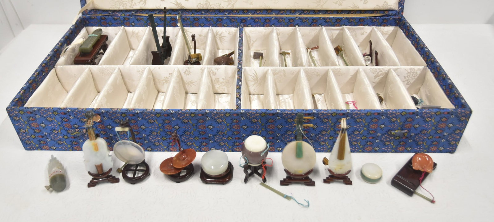 COLLECTION OF CHINESE JADE INSTRUMENTS: COLLECTION OF (24) CHINESE JADE INSTRUMENTS INCLUDING CELLO , CYMBALLS , DRUMS , MANDOLIN , REEDS , LYRE & MORE - 5" LONG (SOME HAVE IMPERFECTIONS)