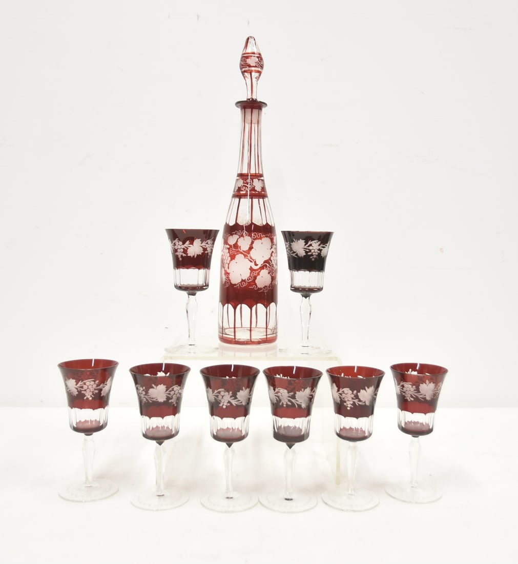 CRANBERRY ETCHED BOHEMIAN GLASS DECANTER SET: BOHEMIAN GLASS ETCHED CRANBERRY DECANTER WITH (8) STEMMED GLASSES ; DECORATED WITH GRAPES & VINES - DECANTER IS 3" x 15 1/2" ; GLASSES ARE 5 7/8"