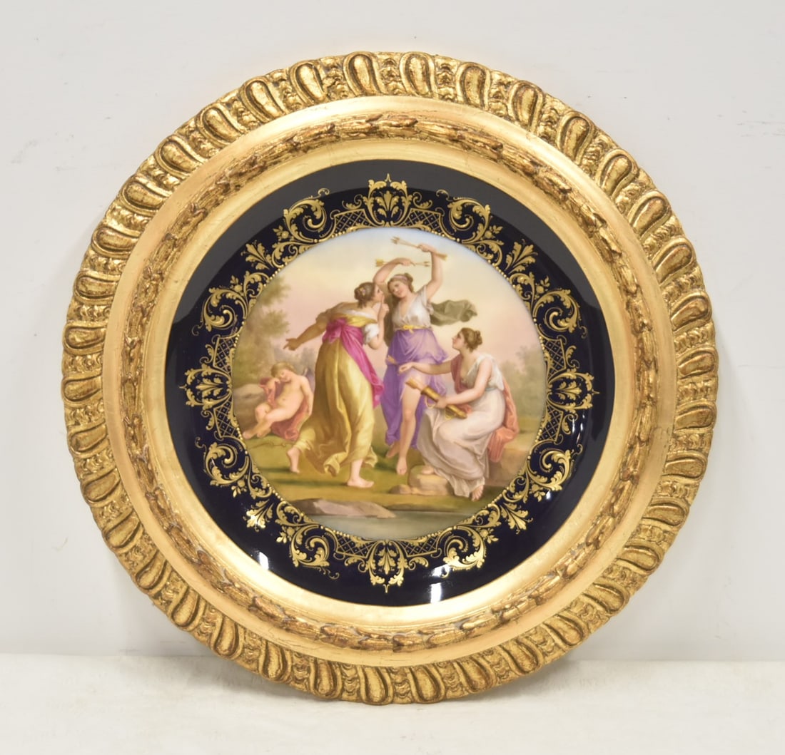 LARGE ROYAL VIENNA FIGURAL CUPID CHARGER: LARGE ROYAL VIENNA PORCELAIN CHARGER WITH HAND PAINTED GROUPING DEPICTING ALLEGORICAL SCENE OF CUPID WILL NO LONGER SEDUCE HEARTS ; TITLED INVERSO AMOR SCHLOFEND , SURROUNDED BY COBALT & GOLD