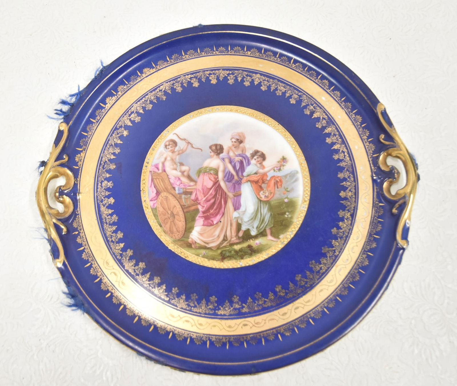 VIENNA STYLE PORCELAIN FIGURAL SCENE PLATE: HAAS & CZJZEK SCHLAGGENWALD ROYAL VIENNA STYLE PORCELAIN TWIN HANDLE PLATE WITH CLASSICAL FIGURES IN MEDALLION - 13" D