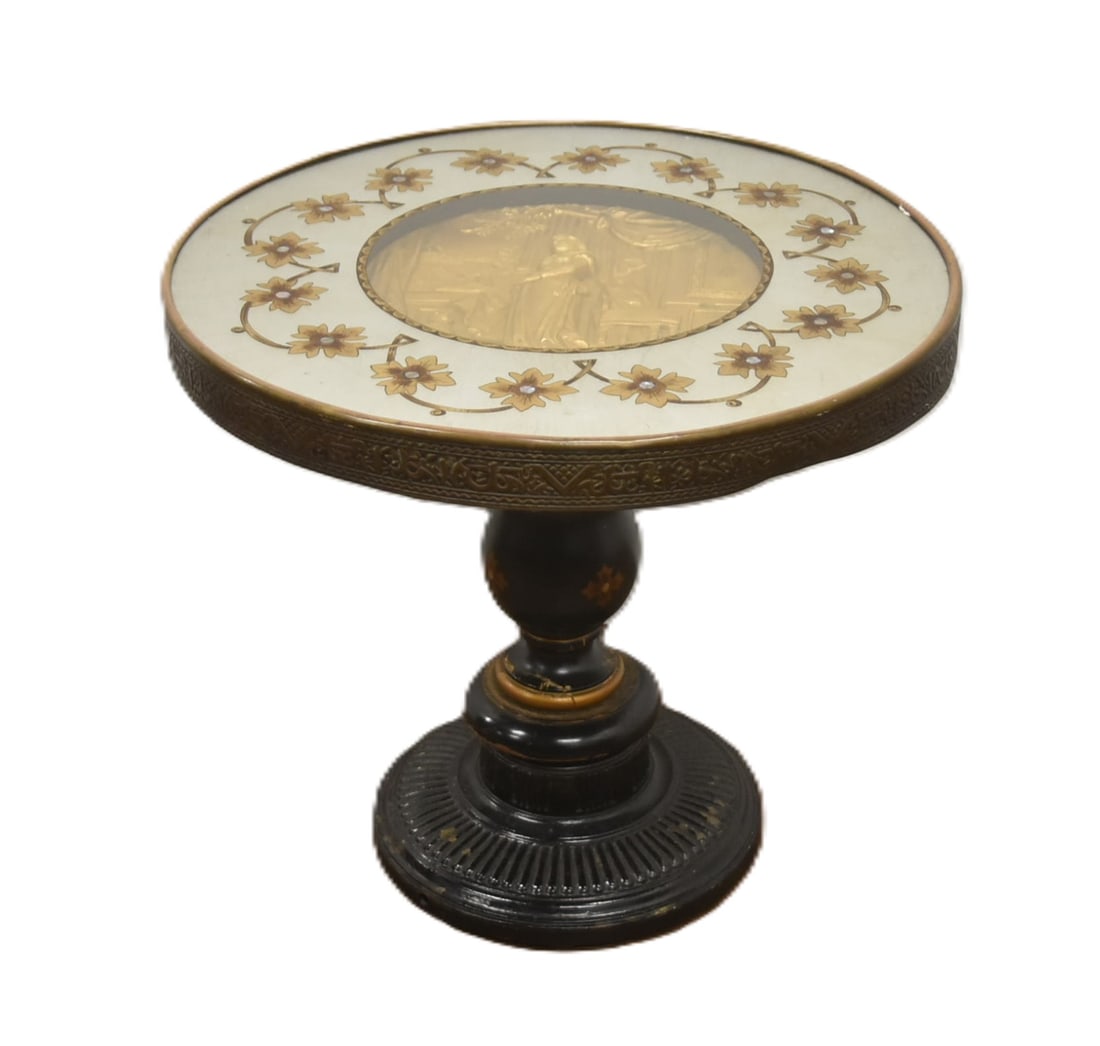 VINTAGE DECORATIVE SIDE TABLE: PAINT DECORATED SIDE TABLE WITH RELIF PLAQUE NOF YOUNG GIRL WITH CAT LOOKING OUT WINDOW MEDALLION WITH GERMAN INSCRIPTIONS "SOHNSUCHT" ; SURROUNDED BY REVERSE PAINTED GLASS - 20" x 17 1/2"