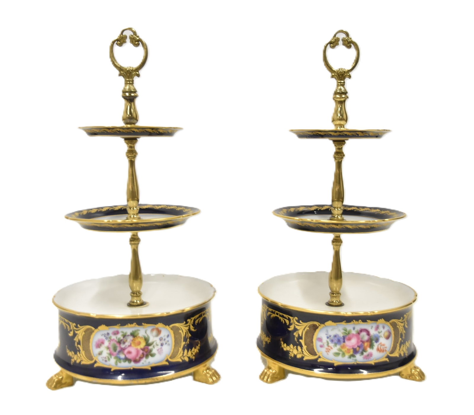 PAIR DRESDEN PORCELAIN 3-TIER DESSERT STANDS: (Pr) DRESDEN - GERMAN PORCELAIN COBALT & GOLD 3-TIERED DESSERT STANDS WITH HAND PAINTED FLOWERS RAISED ON PAW FEET (HAS CRAZING LINE ON TOP OF ONE) 9" x 18" (UNMARKED