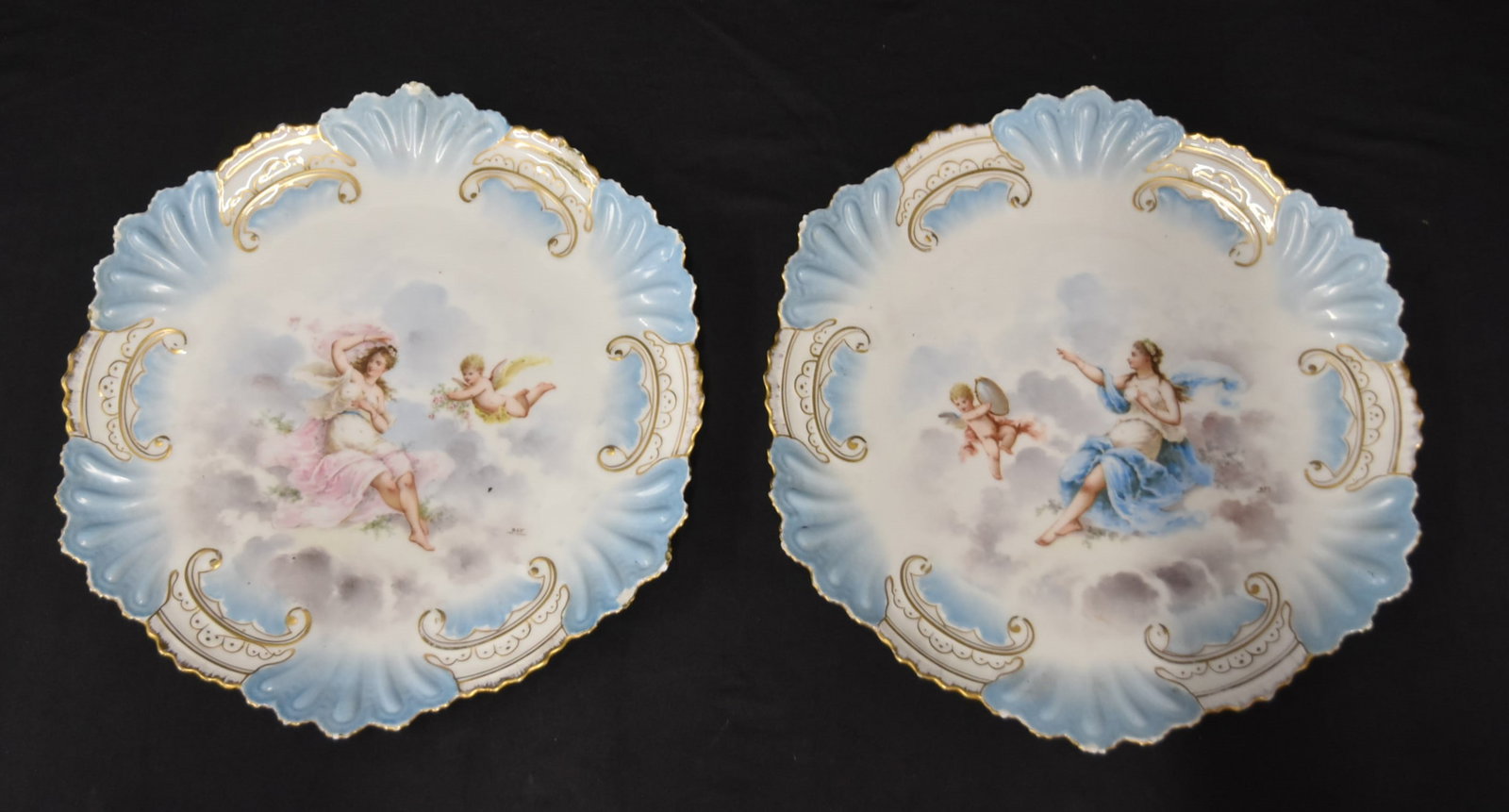 PAIR HAND PAINTED PARIS PORCELAIN CHARGERS: PAIR HAND PAINTED PARIS PORCELAIN CHARGERS WITH WOMEN & CHERUBS HAVING SCALLOPED EDGES - 13" D (ONE CHIP)
