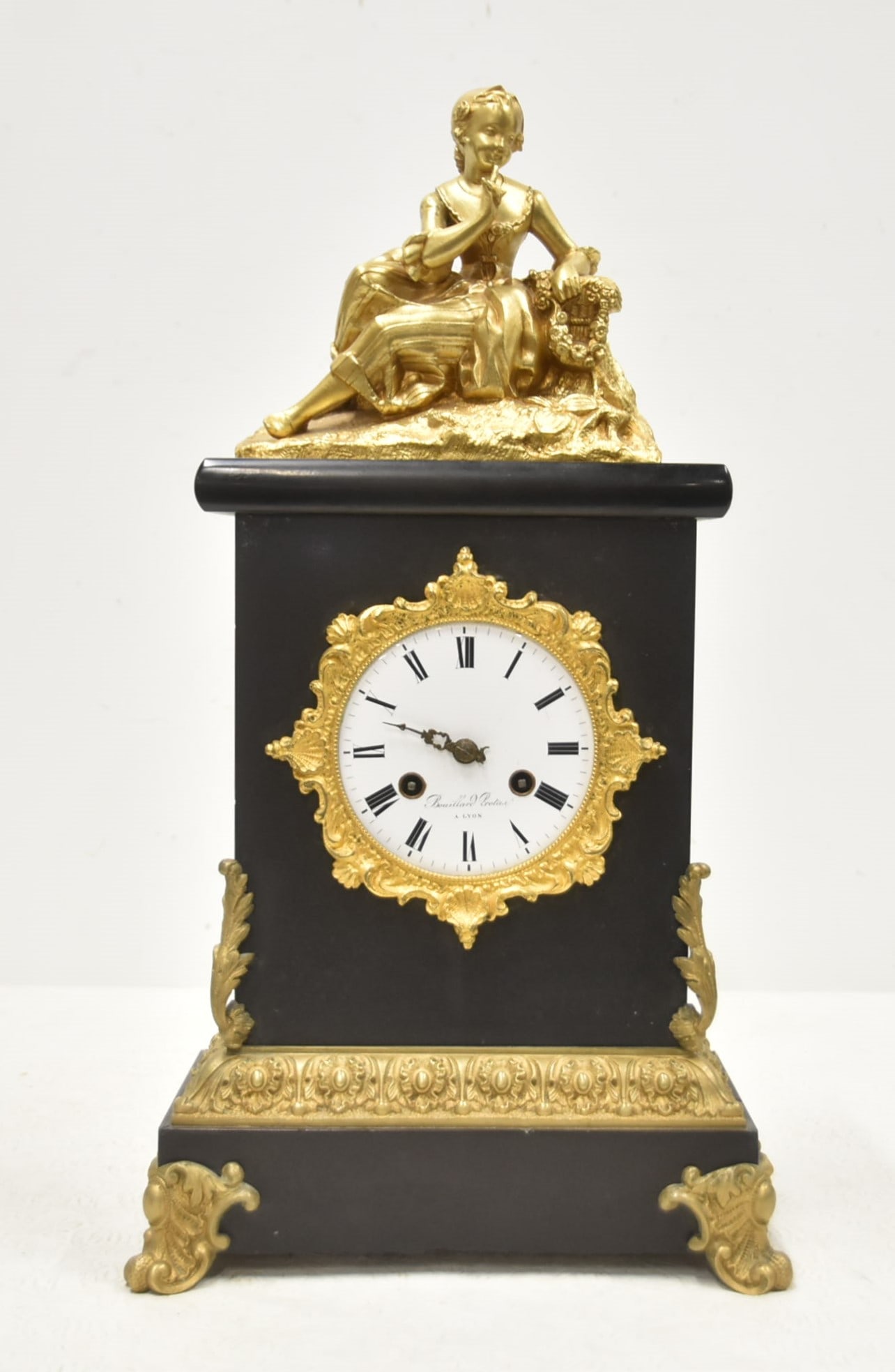 BLACK SLATE & GILT BRONZE MANTEL CLOCK: BOUILLARD PROTAS A LYON BLACK SLATE & GILT BRONZE MANTEL CLOCK WITH YOUNG GIRL SEATED ATOP - 10" x 5" x 18"