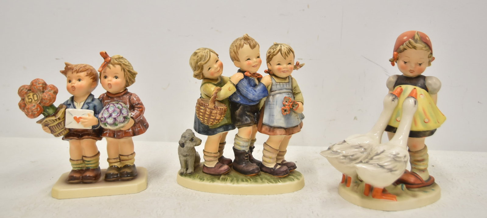 (3) LARGE HUMMEL GOEBEL FIGURINES (1 of 14)