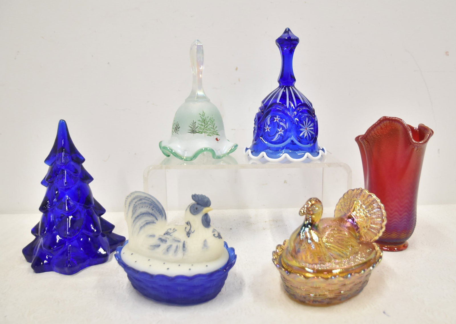 (6)pc FENTON ART GLASS PIECES: FENTON HAND PAINTED BELL / FENTON COBALT BLUE & BLUE CHICK BOX / FENTON COVERED HEN DISH / COBALT HAND PAINTED BELL / COBALT GLASS CHRISTMAS TREE / FENTON RED RUFFLED VASE - LARGEST IS 3 1/2" x 7"