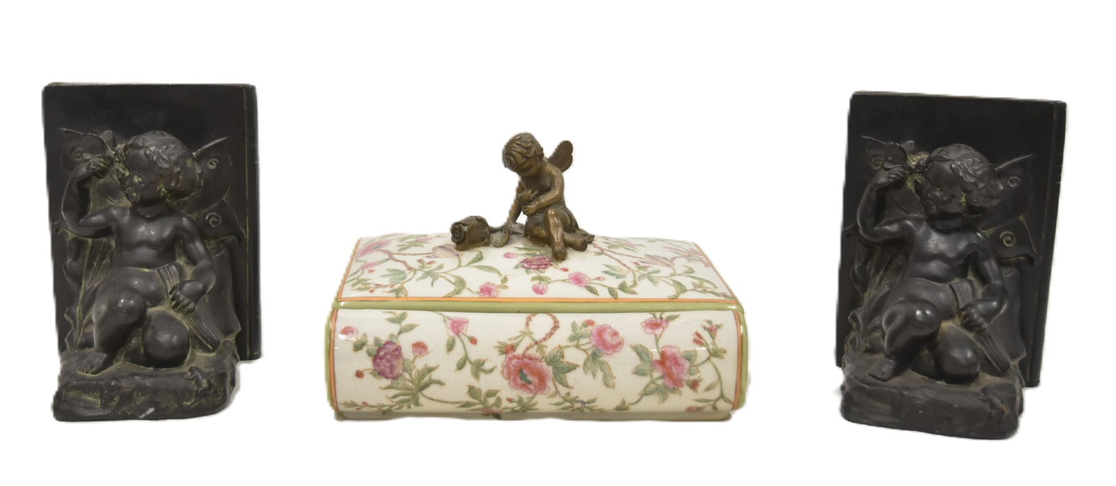 (Pr) CHERUB BOOKENDS / PORCELAIN BOX WITH CHERUB: PAIR PATINATED WHITE METAL CHERUB BOOKENDS / BRONZE MOUNTED PORCELAIN BOOK FORM BOX WITH BRONZE CHERUB FINIAL - BOOKENDS ARE 4 1/2" x 5" x 6" ; BOX IS 7 1/2" x 5" x 5"