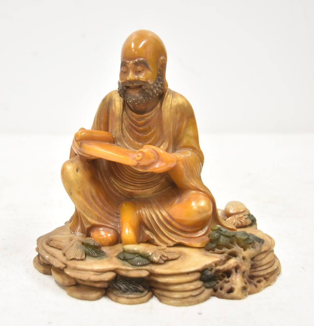 CHINESE SOAPSTONE LOUHAN FIGURE , SIGNED: CHINESE CARVED SOAPSTONE LOUHAN ARHAT FIGURE SCULPTURE ; RAISED ON CARVED BASE - 6" x 5" x 6 1/4" FIGURE IS SIGNED ON BACK
