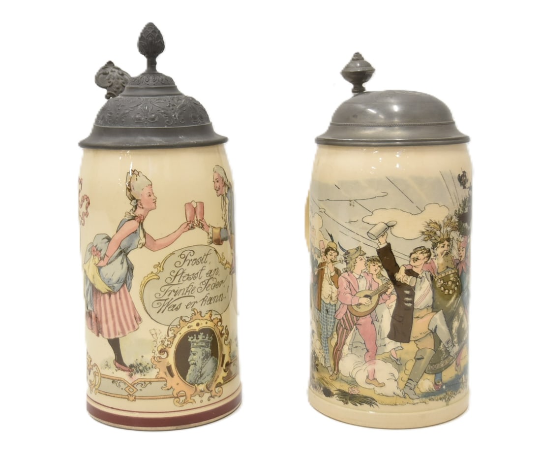 (2) METTLACH 1909 1/2 LITER PUG STEINS: METTLACH 1909 - 1021 PAINTING UNDER GLAZE STEIN "CHEERS TO DRINK TO YOU & YOUR HEALTH" / METTLACH 1909 - 1020 DRINKING PARADE STEIN - LARGEST IS 5" x 4" x 9"