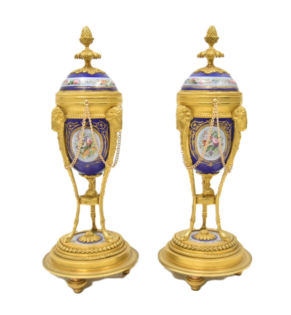 (Pr) SEVRES & BRONZE CONVERTIBLE CASSOLETTES: (Pr) 19th CENTURY HAND PAINTED SEVRES PORCELAIN & DORE BRONZE MOUNTED CASSOLETTES CONVERTIBLE INTO CANDLESTICKS WITH HAND PAINTED FLORAL MEDALLIONS , RAM HEADS & CHAIN - 5" x 13" PAIR FRENCH LOUIS XVI
