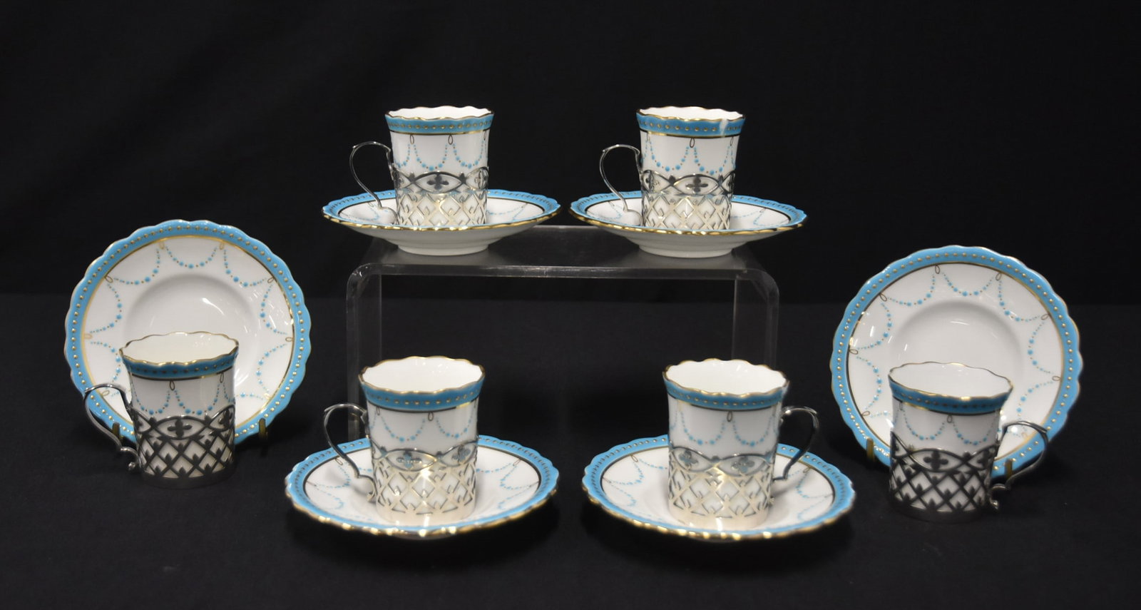 (8) MINTON & STERLING SILVER CUPS & SAUCERS: (8) MINTON ENGLAND PORCELAIN CUPS & SAUCERS WITH ENGLISH STERLING SILVER LINERS ; WITH BLUE ENAMEL JEWELS & GOLD DECORATIONS (ONE CHIP) - 3" x 2 1/2" x 2" OVERALL ; STERLING LINERS ARE 5.71ozt