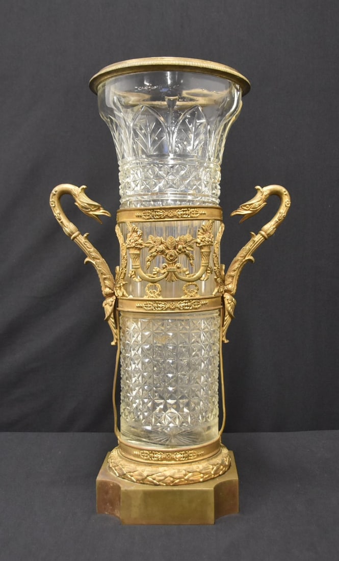 LARGE FRENCH EMPIRE BRONZE & CRYSTAL VASE: LARGE FRENCH EMPIRE BRONZE & CRYSTAL VASER WITH BIRD HANDLES & FLORAL CORNACOPIA MOUNTS OVER LATER CRYSTAL VASE - 10" x 6" x 18 1/2" (GLASS HAS CHIP & CRACK ; CAN BE MADE SHORTER)