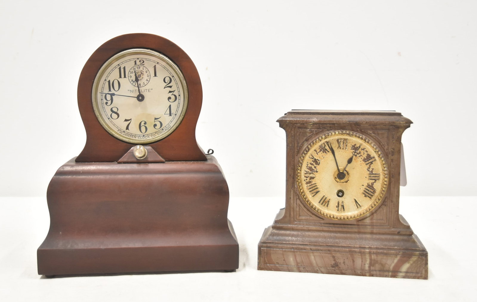 F.W. JANSEN NITE LIGHT ALARM CLOCK / GERMAN CLOCK: F.W. JANSEN NITE LIGHT MAHOGANY CASE ALARM CLOCK WITH BUILT IN LIGHT ; ca. 1910-1920 - 9" x 4" x 11" / GERMAN FAUX MARBLE DESK CLOCK WITH ROMAN NUMERALS FACE - 7 1/2" x 3" x 7 1/2" (FINISH WORN)