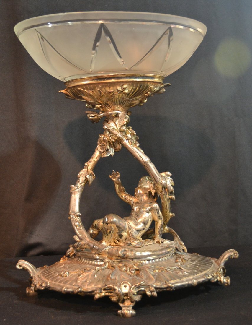 LARGE CHRISTOFLE SILVER PLATE CENTERPIECE: WITH RECLINING PUTTI HOLDING UP FROSTED GLASS BOWL ; MARKED CHRISTOFL ON BOTTOM FOOT - 17" x 12" x 19 1/2" (SOME PATINA LOSS)