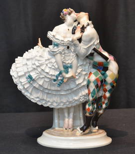 MEISSEN KISSING COUPLE "HARLEQUIN & COLUMBINE": c. 1914 , DESIGNED BY PAUL SCHEURICH AFTER CHARACHTERS IN THE RUSSIAN BALLET "LE CARNIVAL" ; WITH BLUE CROSSED SWORD & MAKERS MARK D. 287 (FINGER PROFESSIONALLY RESTORED)