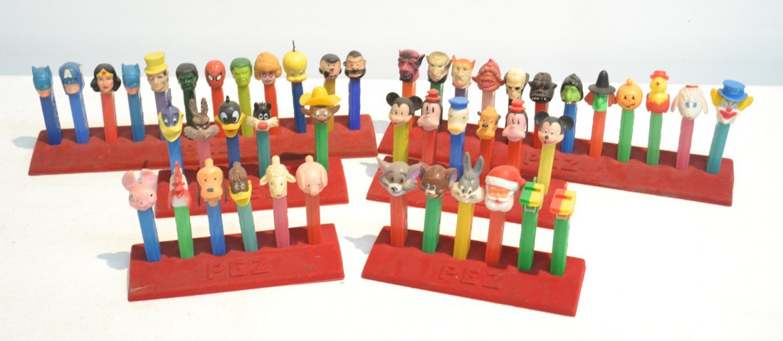 (47) ASSORTED VINTAGE PEZ DISPENSERS INCLUDING: LOONEY TOONS CHARACTERS, MICKEY , SANTA, BUGS BUNNY,TWEETY , BATMAN, CAPT. AMERICA , WONDER WOMAN, DONALD DUCK, GOOFY & MORE