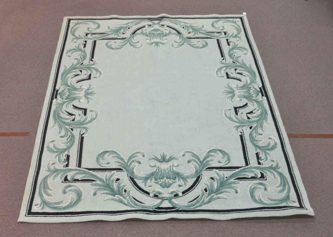 100 % WOOL EDWARD FIELDS RUG WITH MULTI TONE: GREEN GROUND & SCROLLWORK WITH BLACK ACCENTS ; DATED 1990 - 6' x 9'