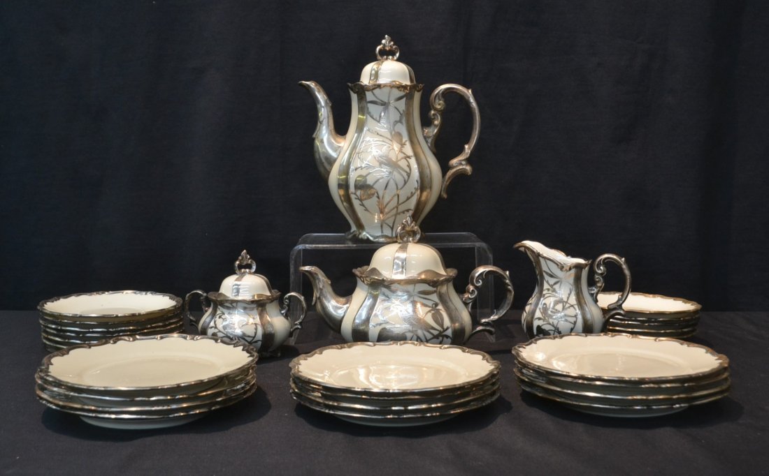 BAVARIAN SILVER OVERLAY PORCELAIN TEA SERVICE: WITH BIRDS CONSISTING OF COFFEE POT, TEA POT, (12) CAKE PLATES, (12) SAUCERS, SUGAR & CREAMER BY HERTZEL JACDE