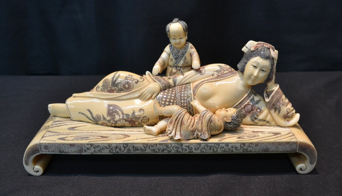CARVED HIPPO RECLINING WOMAN WITH CHILDREN: ON BED- 10" x 3" x 5" (PLEASE NOTE HIPPO IVORY HOLDS NO TRADE RESTRICTIONS AS THEY NATURALLY SHED THEIR TEETH ; EXCEPT FOR NEW JERSEY ;THERE WILL BE NO INTERNATIONAL SHIPPING)