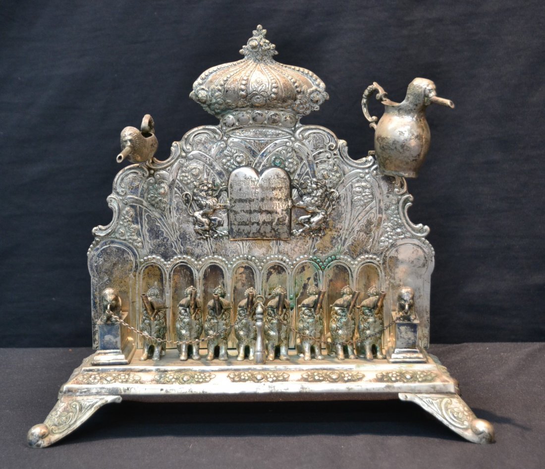 19thC GERMAN 800 SILVER HANUKKAH MENORAH: FEATURING (8) SEATED LIONS SERVING AS WICK HOLDERS SURROUNDED BY (2) BIGGER LIONS WITH FINE REPOUSE FLOWERS & LIONS HOLDING TEN COMMANDMENTS WITH (2) REMOVABLE SHAMASH & OIL PITCHER - 12 1/2" x 6" x 1