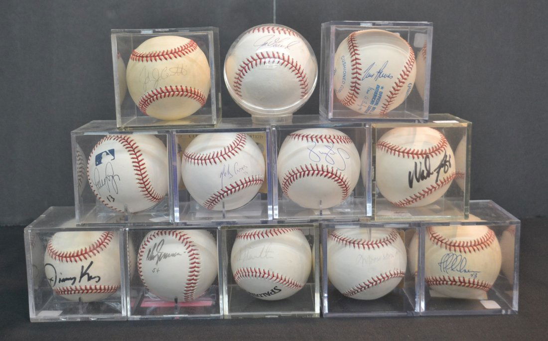 (12) SIGNED BASEBALLS INCLUDING TIM RAINES , WADE: BOGGS, JOHN CERUTTI, JIM LEYRITZ, JOE GIRARDI, JEFF NELSON, DON ZIMMER, BUCK SHOWALTER, MELKY CABRERA (STEINER COA), JIMMY KEY , MOOSE SKOWRON (STEINER COA) & DARRYL STRAWBERRY
