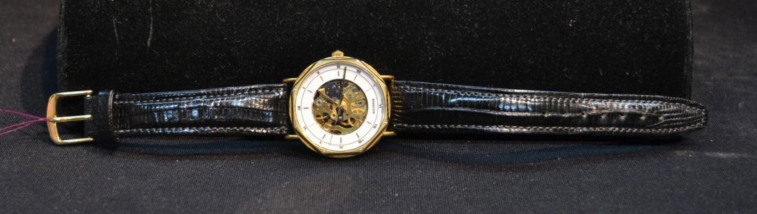 BUCHERER OPEN ESCAPEMENT WATCH WITH: LEATHER HAND - 1 1/4" DIAL ; 9" LONG
