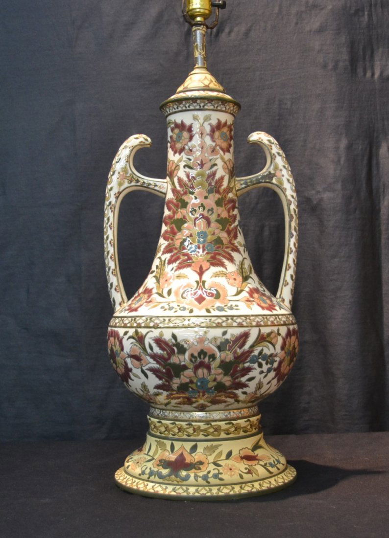 LARGE TWIN HANDLE ZSOLNAY LAMP WITH FLORAL: DECORATIONS & PAINTED WOOD BASE (ONE HANDLE RESTORED) 10" x 23" TO SOCKET