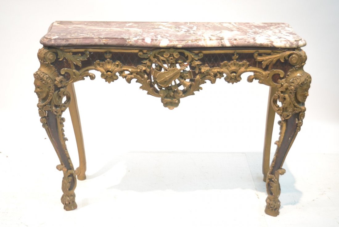 EARLY 19thC CARVED GILT MARBLE TOP CONSOLE: WITH MUSICAL MOTIFF & MASKS WITH HEADRESSES ON LEGS OVER HOOF FEET - 41" x 16" x 31"