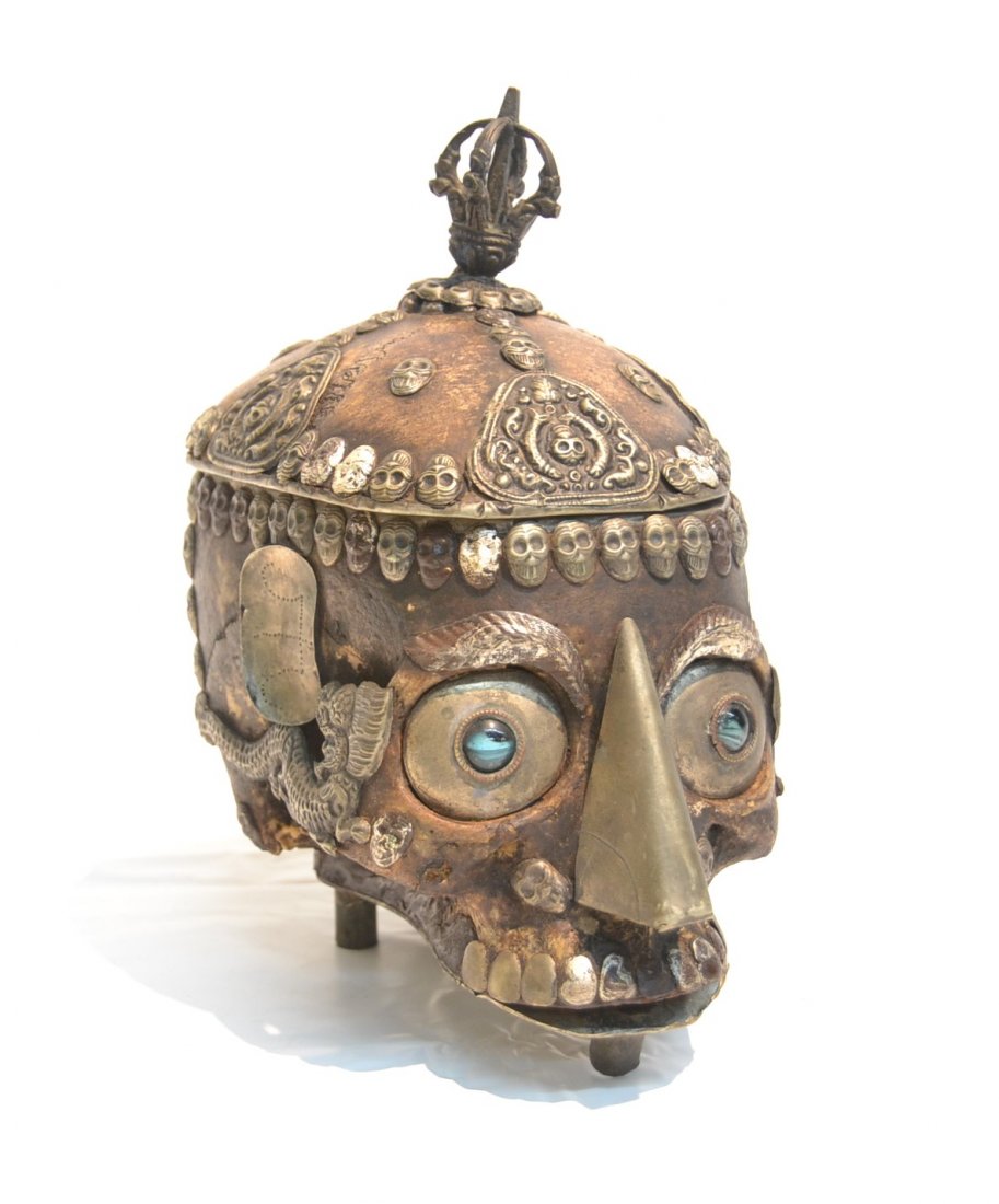 TIBET OR NEPAL CEREMONIAL SILVER MOUNTED SKULL: BOWL WITH JEWELED EYES & SILVER SKULL DECORATIONS - 8 1/2' x 5" x 9" (SOME LOOSE PIECES)