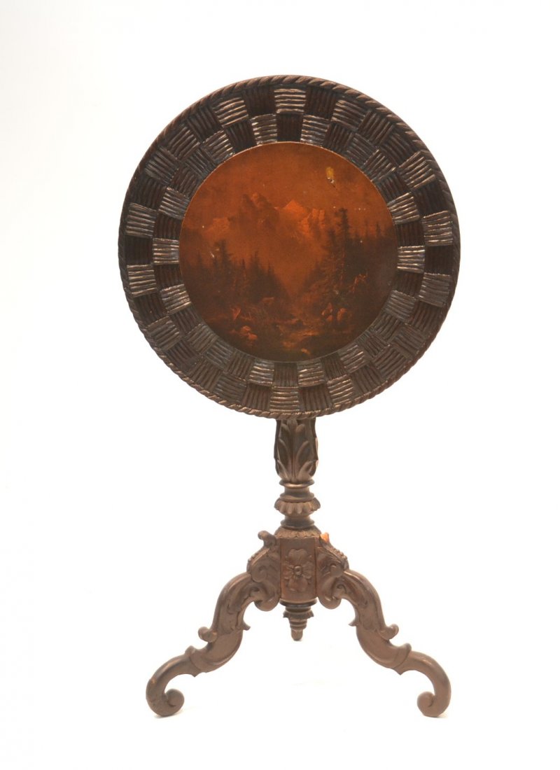 CARVED BLACK FOREST FLIP TOP TABLE WITH HAND: PAINTED FOREST SCENE & CROSS HATCH DESIGNS ATOP CARVED BASE MARKED C.G. BRUNNER IN BOENIGEN (MISSING SOME MOLDING) - 21" x 29"