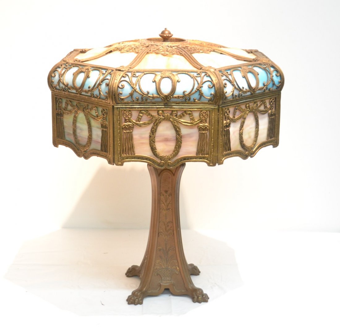 TRI COLOR BENT SLAG GLASS SHADE TABLE LAMP WTH: WITH HEAVY FILIGREE ON CLAW FOOT BASE (REPAIR ON RIM OF SHADE) - 19" x 23"