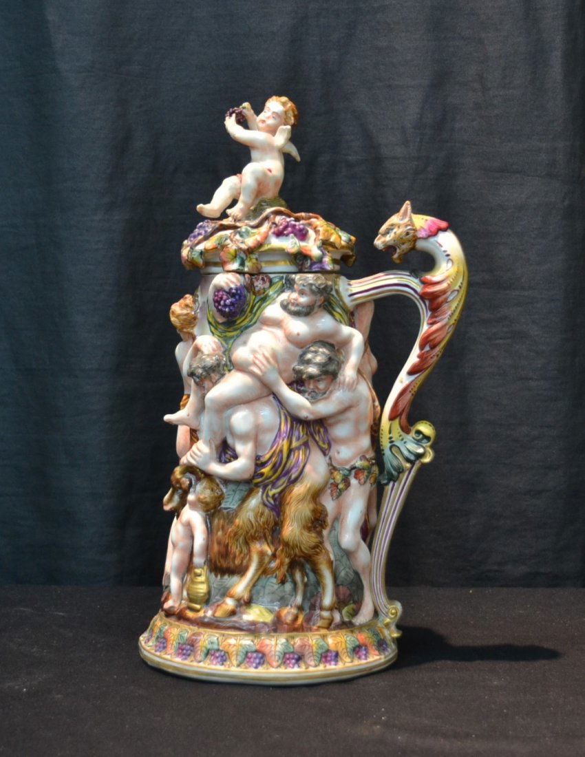 FRENCH CAPODIMONTE COVERED TANKARD: WITH HEAVILY RAISED FIGURES , LEOPARD HEAD HANDLE & CHERUB FINIAL - 8" x 15"