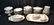 LIMOGES DINNER SERVICE WITH GOLD DECORATIONS