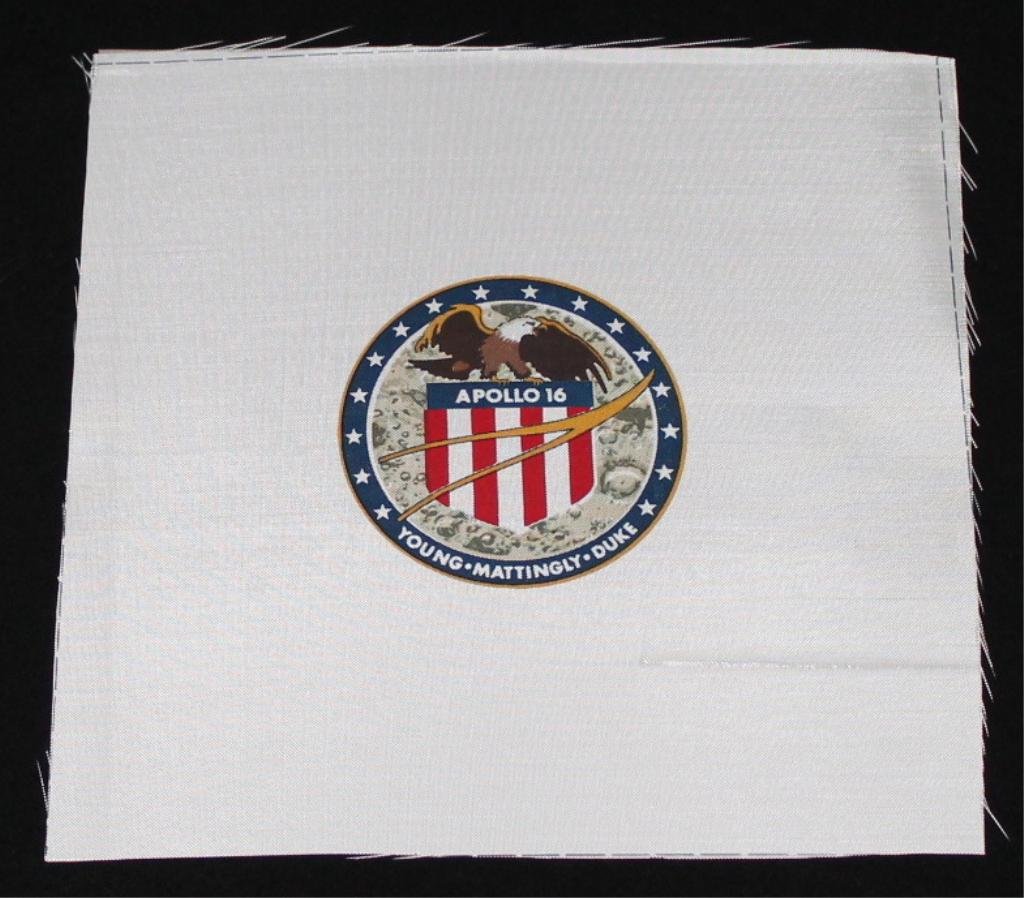 Apollo 16 Beta Cloth Patch: A 9"x 9" Apollo 16 beta cloth patch with good color registration and with all four cut lines visible. A bottom right thread flaw, but otherwise nice condition.