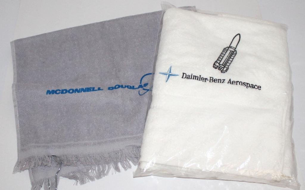 Daimler-Benz Aerospace & McDonnell Douglas Towels: A Daimler-Benz Aerospace logo towel and a McDonnel Douglas golf towel both in new condition.