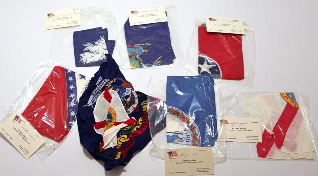 Group of Nine Unflown State Flags, Apollo-Era: Nine vintage state flags that were to be flown to the moon on Apollo missions, but were left behind. Most are about 8"x 10" and many come in their original packaging with the maker's business card.