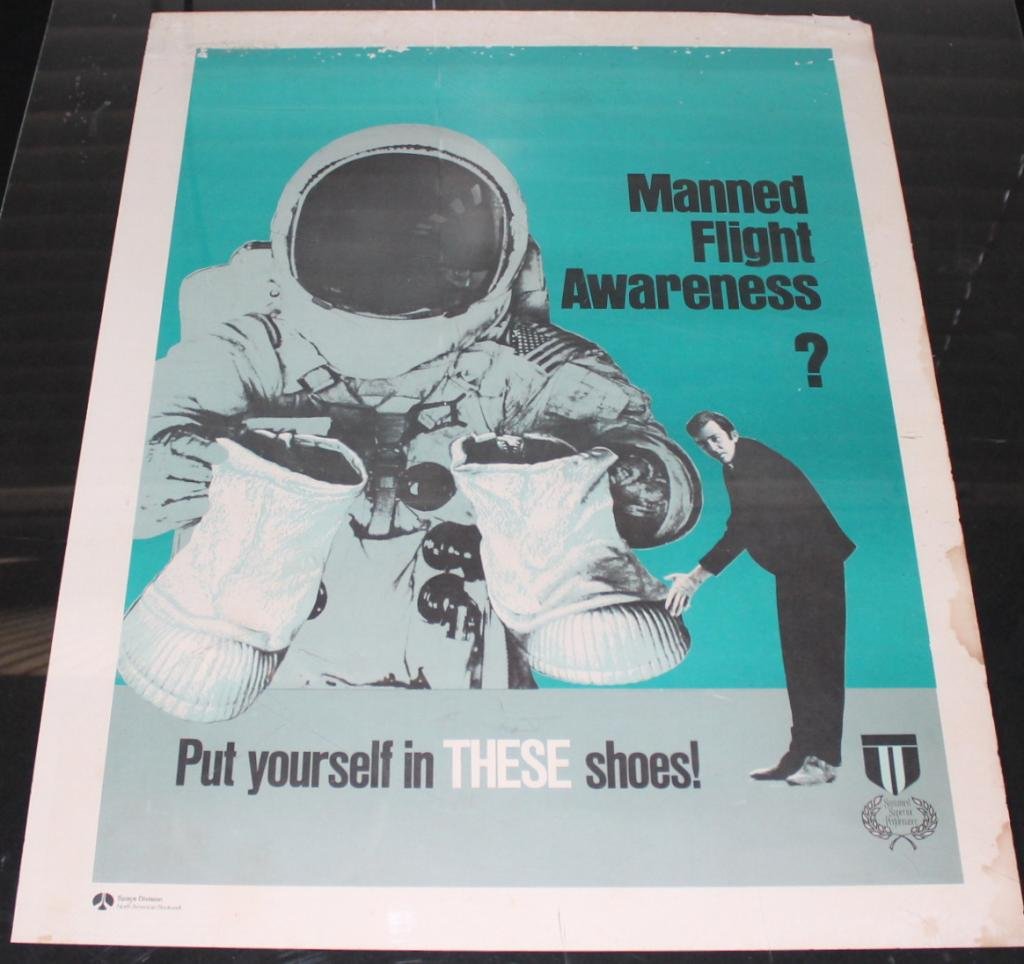 NAR Space Division Manned Flight Awareness Poster: A vintage 17"x 22" Apollo Program Manned Flight Awareness poster from the North American Rockwell Space Division. Some spotting and insect damage at the top, as well as a top right corner bend. And st