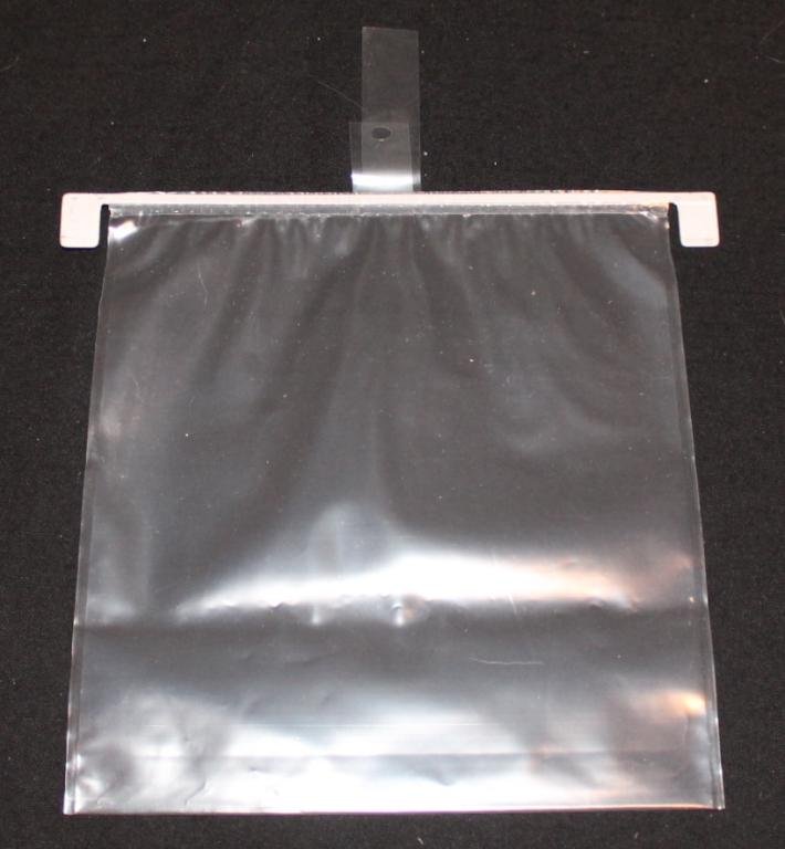 Lunar Surface Sample Collection Bag: A 7½"x 8" plastic lunar sample collection bag of the type actually used on the lunar surface by the astronauts. I have provided a photo of Charlie Duke on the lunar surface collecting a rock sample u