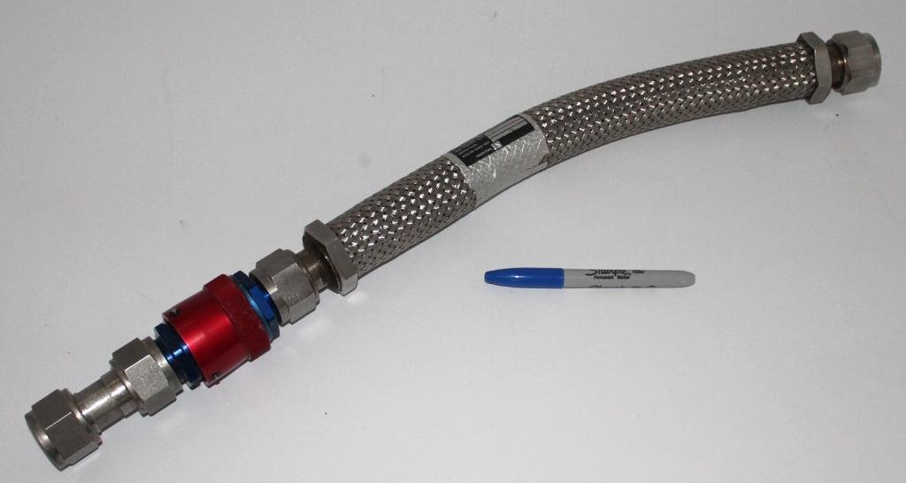 Apollo Era NAR Flex Hose: A 25" long heavy flex hose, about 1" diameter, with heavy fittings on each end. Made by North American Rockwell with a proof test date of 6-6-68. Service is for Helium and Gaseous Nitrogen. Great cond