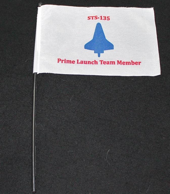 Mike Leinbach's STS-135 Prime Launch Team Member Flag: A 4"x 6" STS-135 flag made for the last launch of the Space Shuttle, STS-135. Only 250 of these were produced and 180 of them were given out to members of the Launch Team. Excellent condition. From th