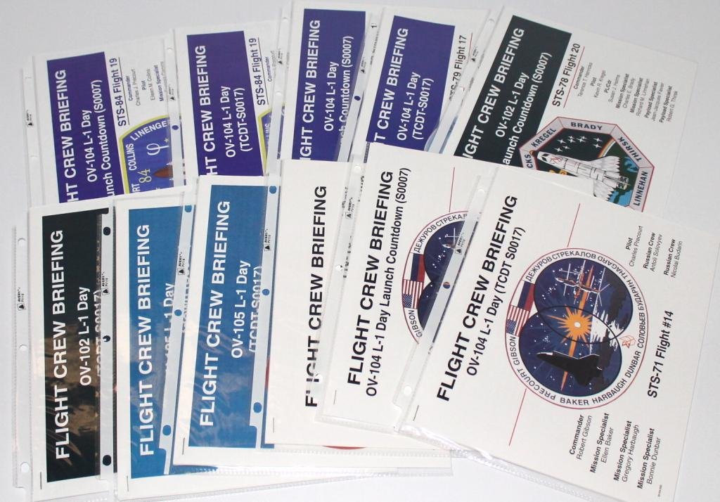 Group of 13 Different Flight Crew Briefing Manuals: A group of 13 different Flight Crew Briefing manuals from NASA for either the Launch Countdown or the Demonstration Test. Represented are STS-43, 51, 52, 55, 57, 63 and 66. Three astronaut autographs
