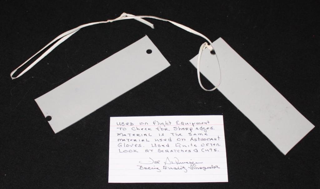Sharp Edge Testing Materials: Two 2"x 6" rubberized pads, made of the same material used on an astronauts gloves, used in testing for sharp or jagged edges on equipment that could possibly compromise a spacesuit. One of the pads l