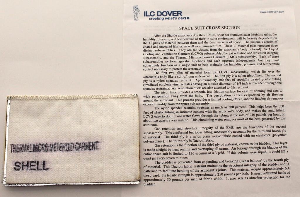 Shuttle Spacesuit Layered Material Swatch From ILC: A 4"x 6" section of spacesuit material showing all the layers involved in manufacturing a suit, including the cooling tube. A two-page explanation of the layers, from ILC Dover, is included. Great con