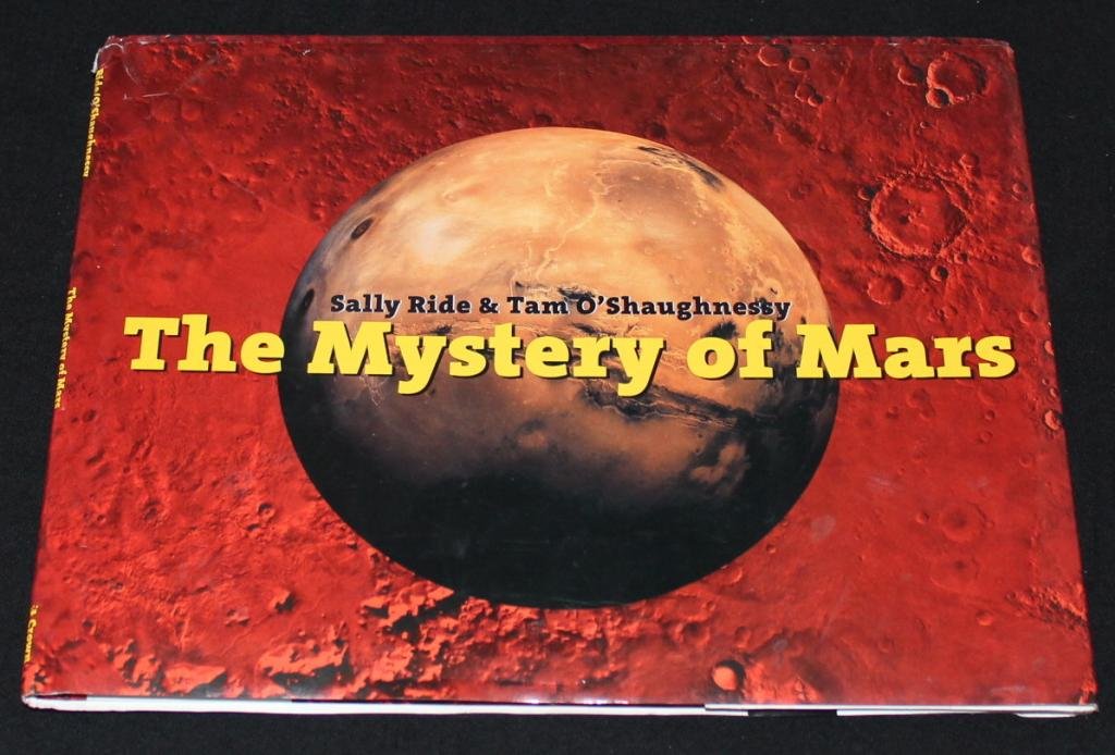 Sally Ride Signed 'The Mystery of Mars' Book: Sally Ride's hardbound 1999 book, 1st printing, with dust jacket and signed on the title page by Ride. Very fine condition.