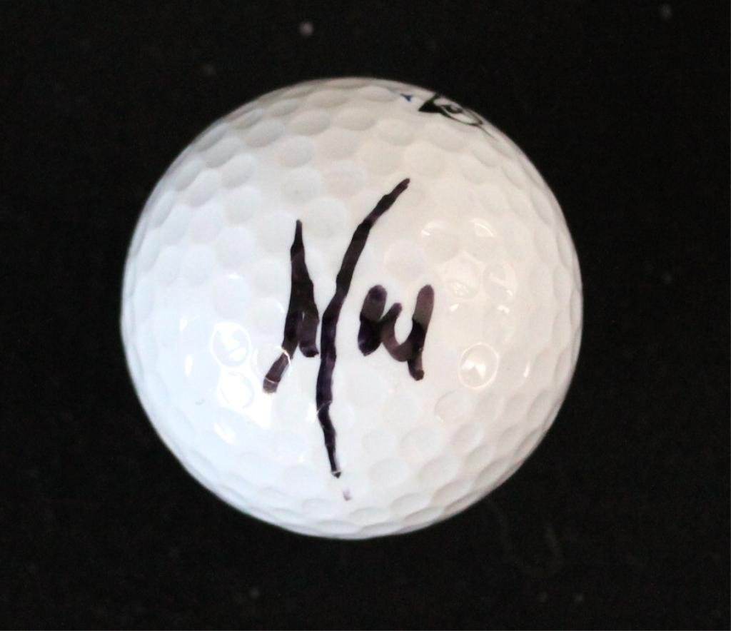 Neil Armstrong Signed Golf Ball, 'Neil': Note: This item will not come with a COA. Being that the signature is on a dimpled golf ball, which would cause any signature to exhibit irregularities, this signature will probably never be authentic