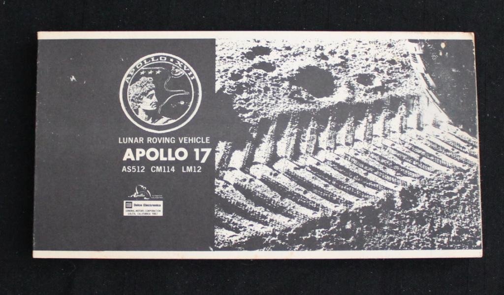Apollo 17 Lunar Roving Vehicle Booklet: A vintage 3.5"x 7" Apollo 15 Lunar Roving Vehicle booklet from Delco Electronics with 32 pages of photos, illustrations and information. Some toning and spots on the back cover, but overall very fine