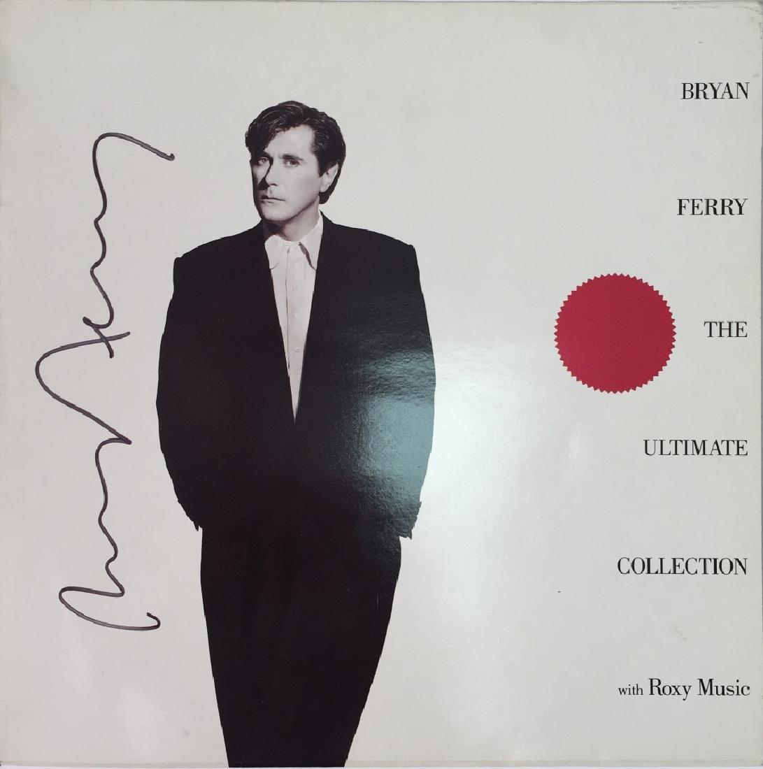 BRIAN FERRY SIGNED: BRIAN FERRY SIGNED. Two pieces of Bryan Ferry/Roxy Music signed memorabilia to include a copy of Bryan Ferry - The Ultimate Collection signed to front of sleeve in gold ink by Bryan Ferry and the same