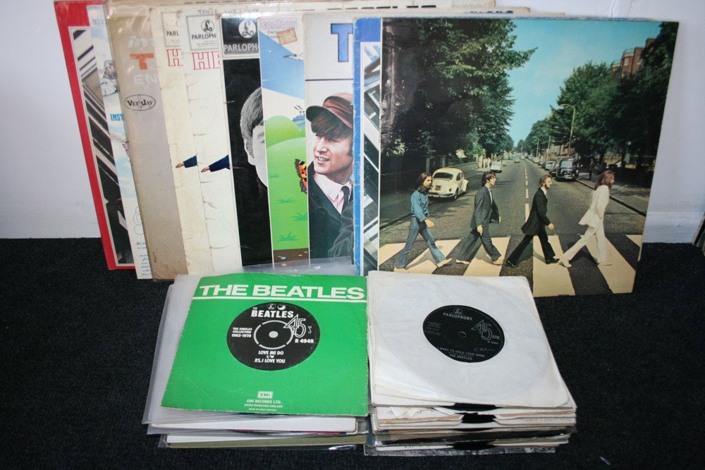 THE BEATLES: THE BEATLES - Collection of 39 7" singles and 11 LPs by The Beatles. LPs include: 'Introducing The Beatles' (bootleg - SR1062), 2 x 'Help!' mono 1st press (PMC1255), 'Beatles For Sale' mono 1st (PMC12
