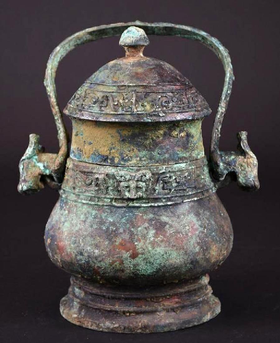 Chinese Bronze Footed vessel with Handle (1 of 10)