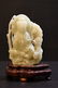 Carved celadon Jade seated Guan Yin